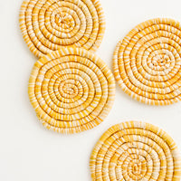 Marigold: Set of 4 Round Woven Raffia Coasters in Yellow and natural stripe.