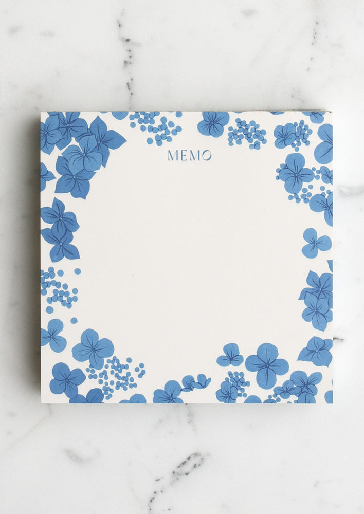 1: A square notepad with blue hydrangea border, reading "memo" at the top