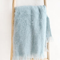 Glacier: Fluffy mohair blanket with soft fringe trim in serene shade of blue