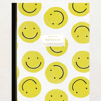Smiley Face: A notebook with yellow smiley face printed cover.