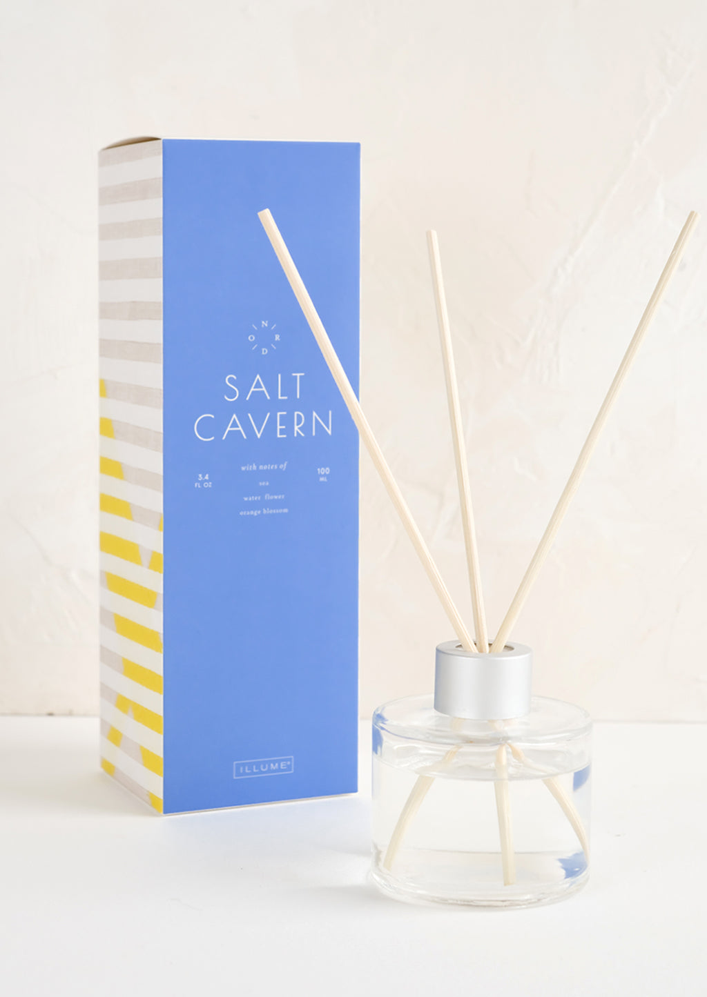 Salt Cavern: A tall box with glass reed diffuser bottle.