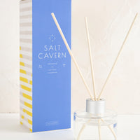 Salt Cavern: A tall box with glass reed diffuser bottle.