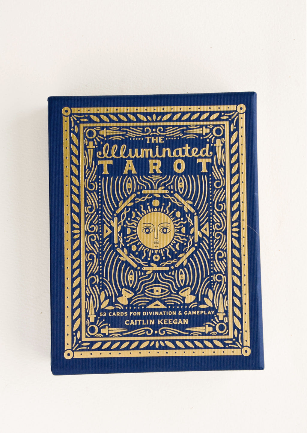 1: Decorative gift box of tarot cards in dark blue with metallic gold imagery