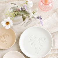 6: Porcelain plates on a table.