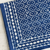 1: An indigo block printed tablecloth.