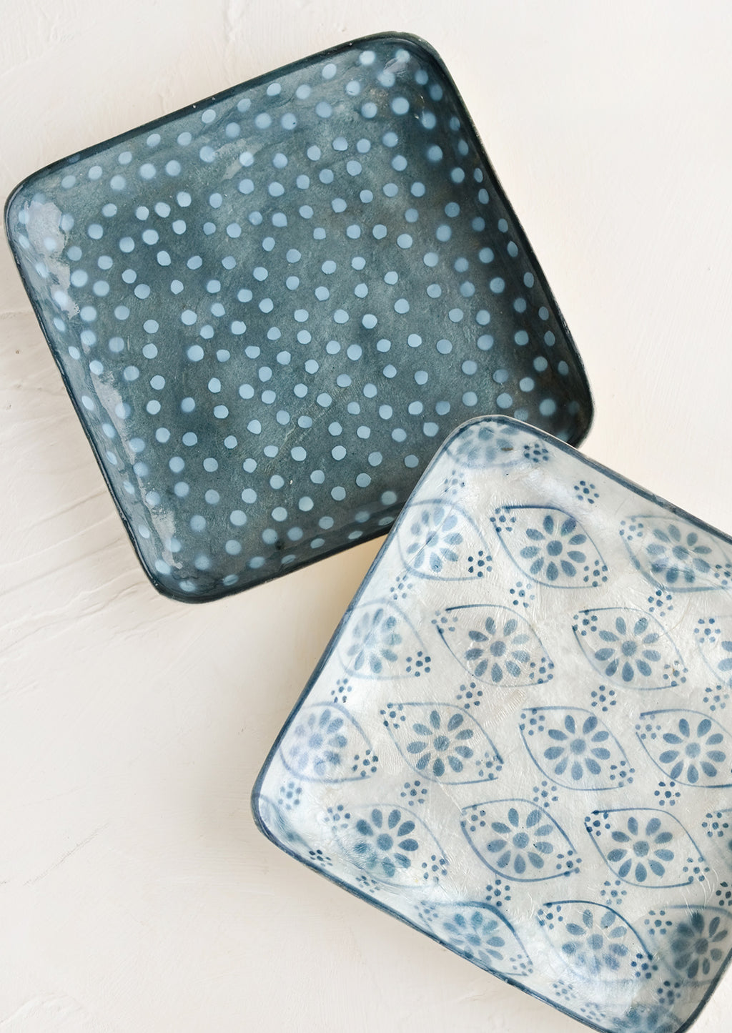1: Square catchall trays in assorted indigo motifs.