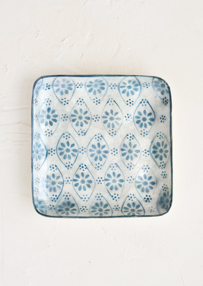 Floral Motif: A small square catchall tray in indigo motif.