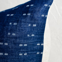 2: Woven indigo fabric with dash pattern woven in.