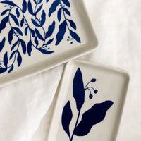 1: Blue botanical print trays in small and large.