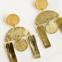 1: A pair of gold earrings with geometric chandelier design.