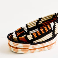 3: Oval shaped shallow bread baskets made from woven natural grass in geometric patterns