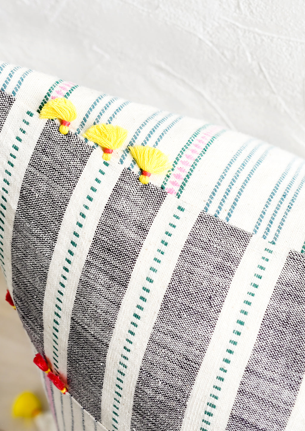 3: Two sided pillow detailing with tassels.