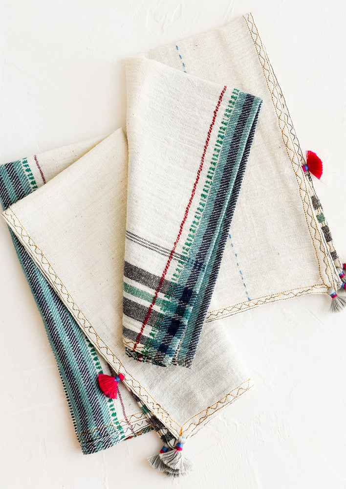 1: A pair of khadi cotton napkins with tassel detailing.