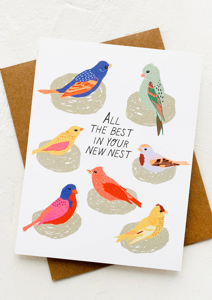 A card with image of birds on nests, text reads "All the best in your new nest".