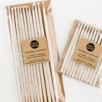 Short / Ivory: Two packages of ivory beeswax birthday candles in short and long lengths.
