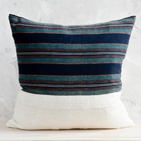 1: A square throw pillow with half striped japanese hemp, half natural mudcloth.