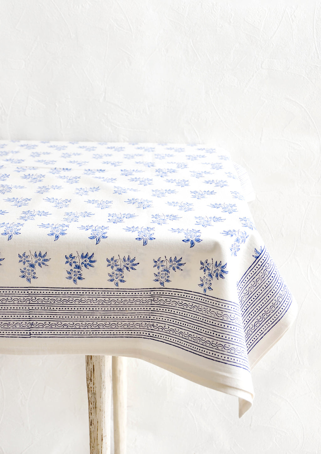 2: White cotton tablecloth with blue floral print and patterned border