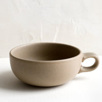 Sand: A ceramic bowl mug in sand brown.