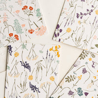 1: Four cards with wildflower patterns in slightly different designs and colors.