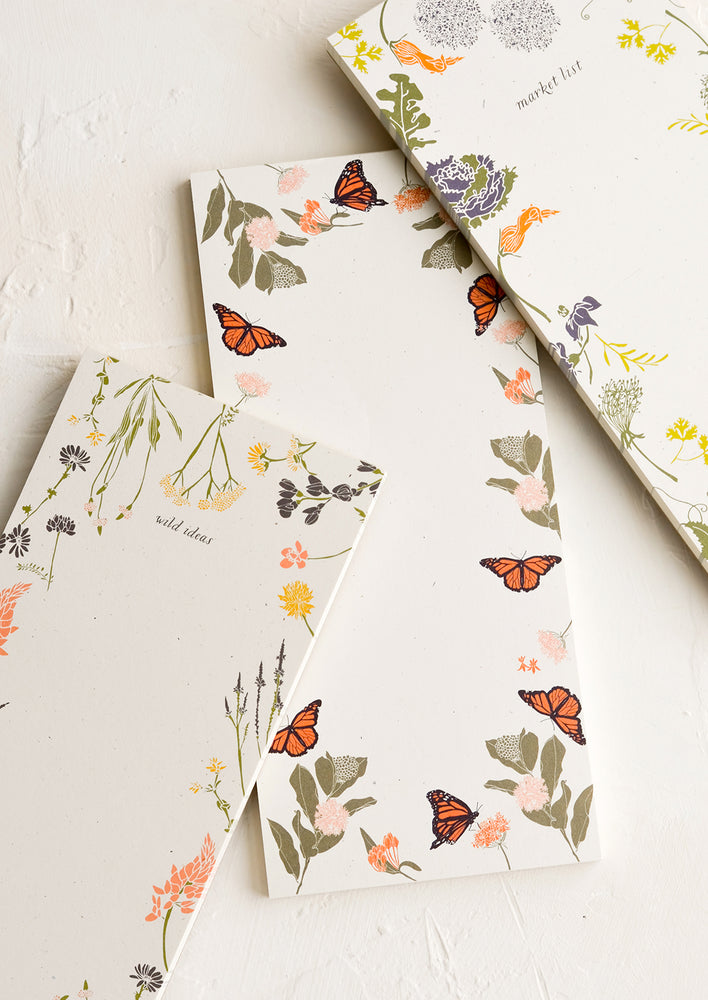 1: Various list making notepads with botanical print borders.