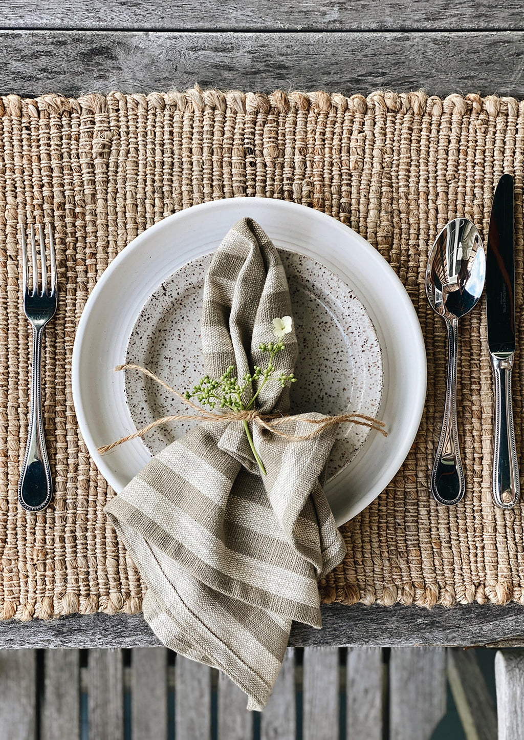 3: A jute placemat with tableware setting.
