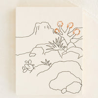 Natural: A white cloth covered journal with desert themed embroidery.