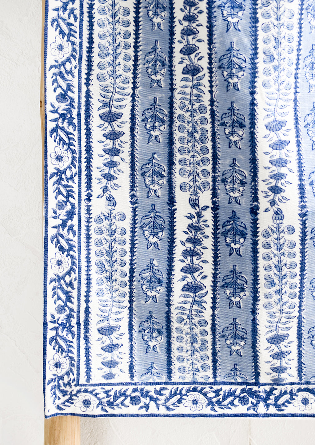 5: A stripe floral print table runner in blue and white.