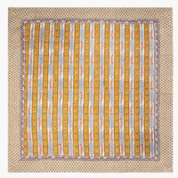 3: A stripe floral print tablecloth in marigold, purple and blue.