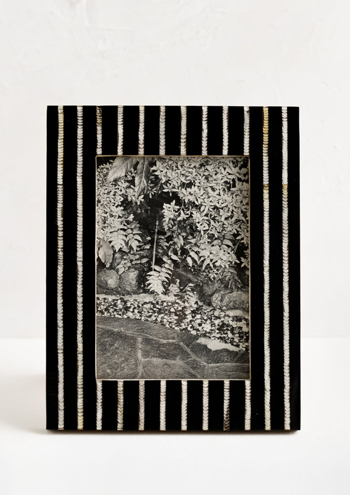 A black and white striped picture frame.