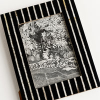 2: A black and white striped picture frame.A black and white striped picture frame.
