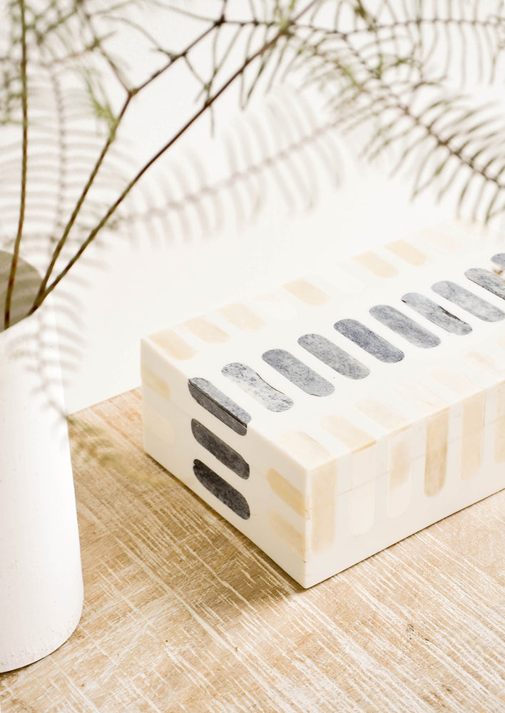 Decorative storage box made from bone with tan and grey inlay