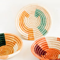 1: Assortment of three woven raffia bowls in a mix of color combos