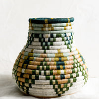 2: A sweetgrass woven vase with bulbous shape.