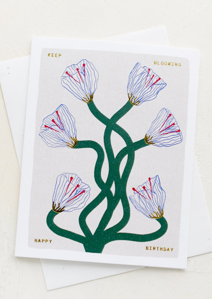 1: A greeting card with image of flowers, text reads "Keep blooming, happy birthday".