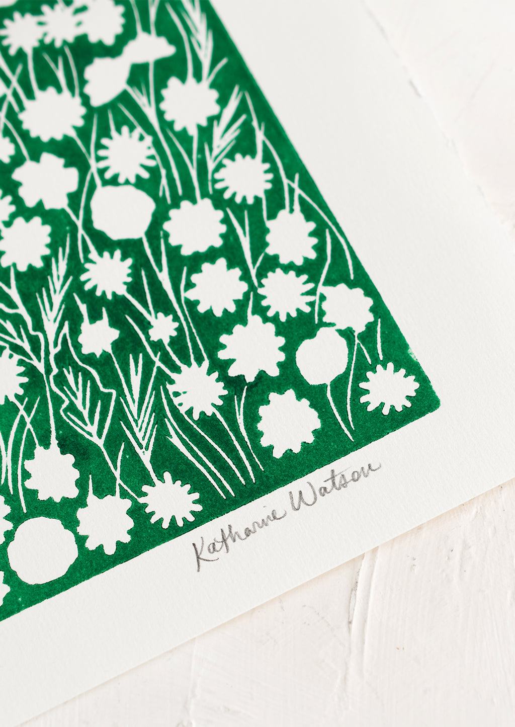 2: A block printed art print on deckled edge paper with green box with white flowers.