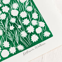 2: A block printed art print on deckled edge paper with green box with white flowers.