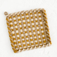 Ochre / Ivory / Taupe: A hand-knit potholder in checkered weave of ochre, taupe and natural.