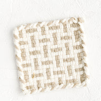 Natural / Taupe: A hand-knit potholder in natural and taupe woven pattern.