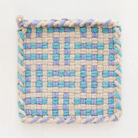 Hydrangea / Cyan / Tan: A hand-knit potholder in blue and turquoise woven pattern.