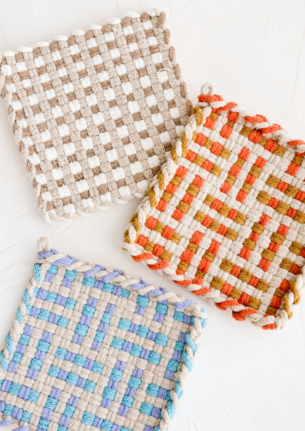 2: Hand knit potholders in assorted colors and patterns.