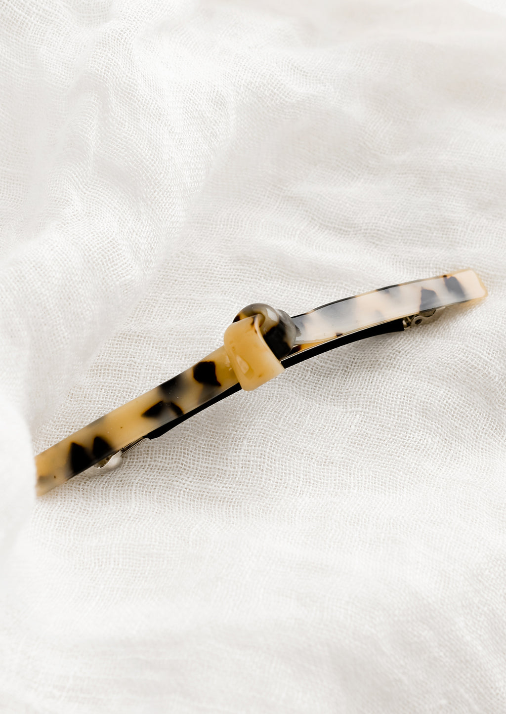 Blonde Tortoise: Acetate barrette with knot detail in tortoise