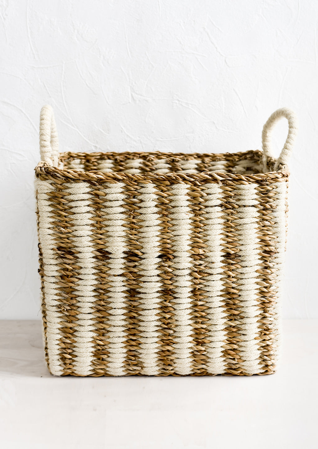 Large [$98.00]: A square storage basket in woven straw and jute, large size.