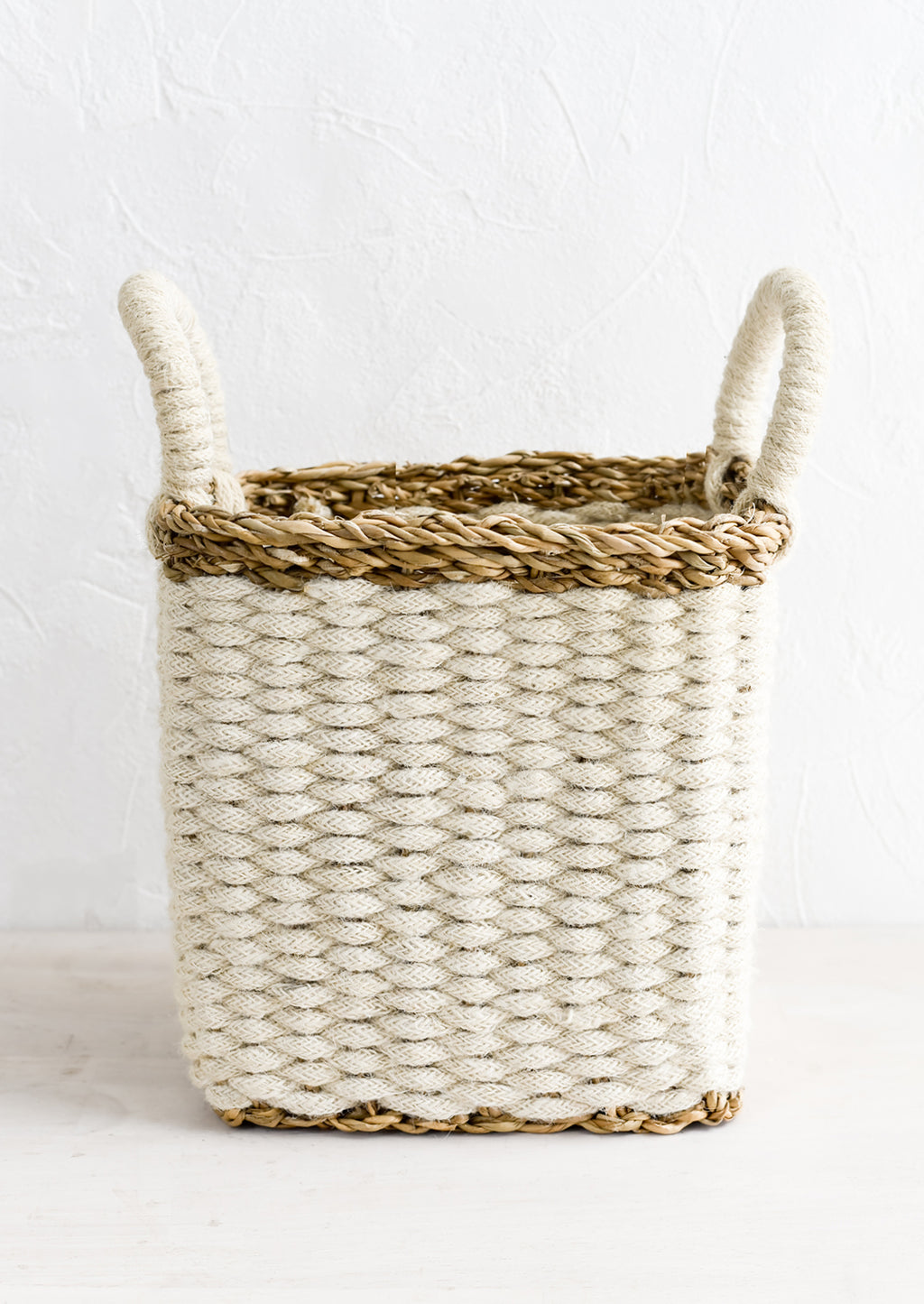 Small [$60.00]: A square storage basket in woven straw and jute, small size.