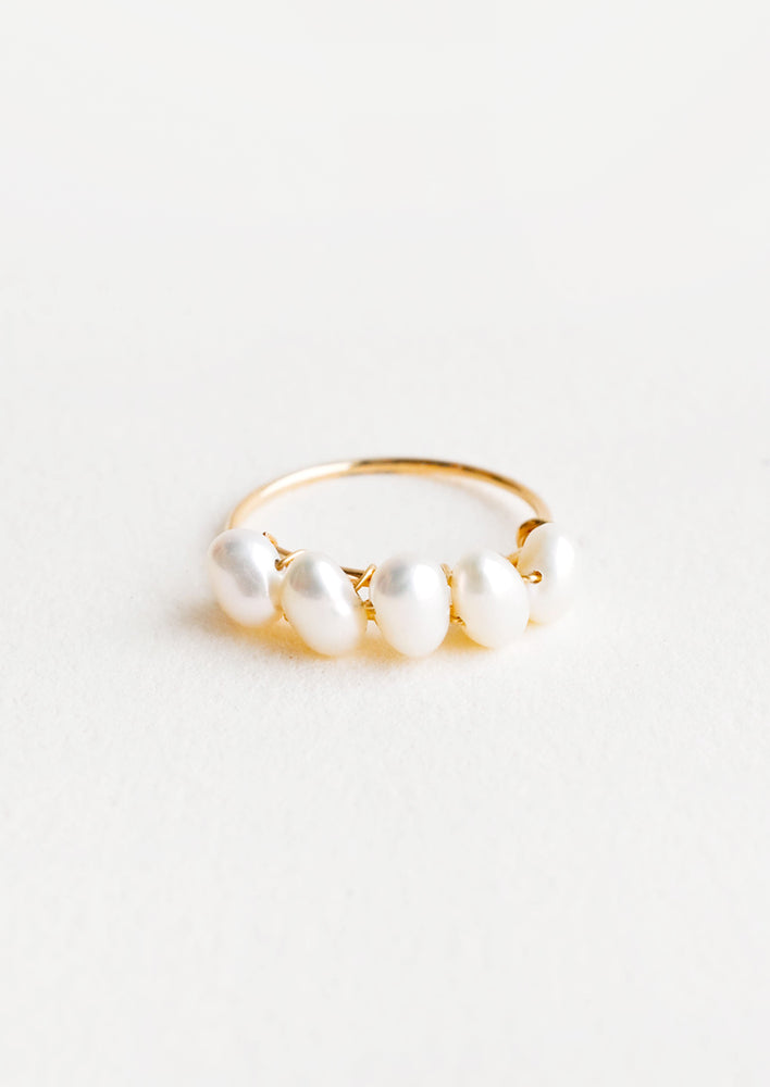 1: Thin gold ring with multiple pearls wrapped around front