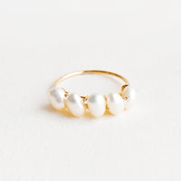 1: Thin gold ring with multiple pearls wrapped around front