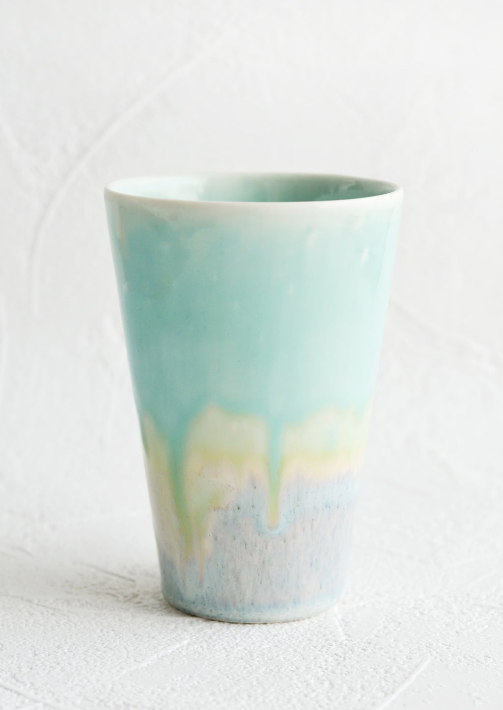 Aqua / Blue: A ceramic cup in aqua.