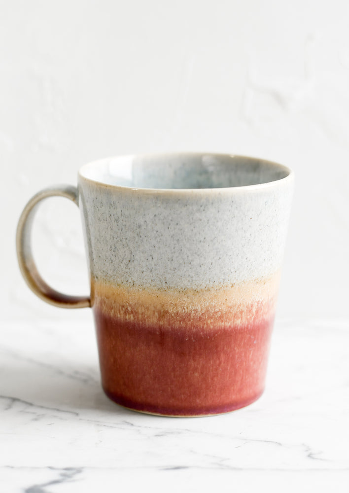 Cloud / Currant: A ceramic coffee mug with handle in speckled grey-blue and currant glaze.