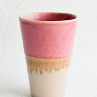Dark Pink / Beige: A ceramic cup in pink and brown.