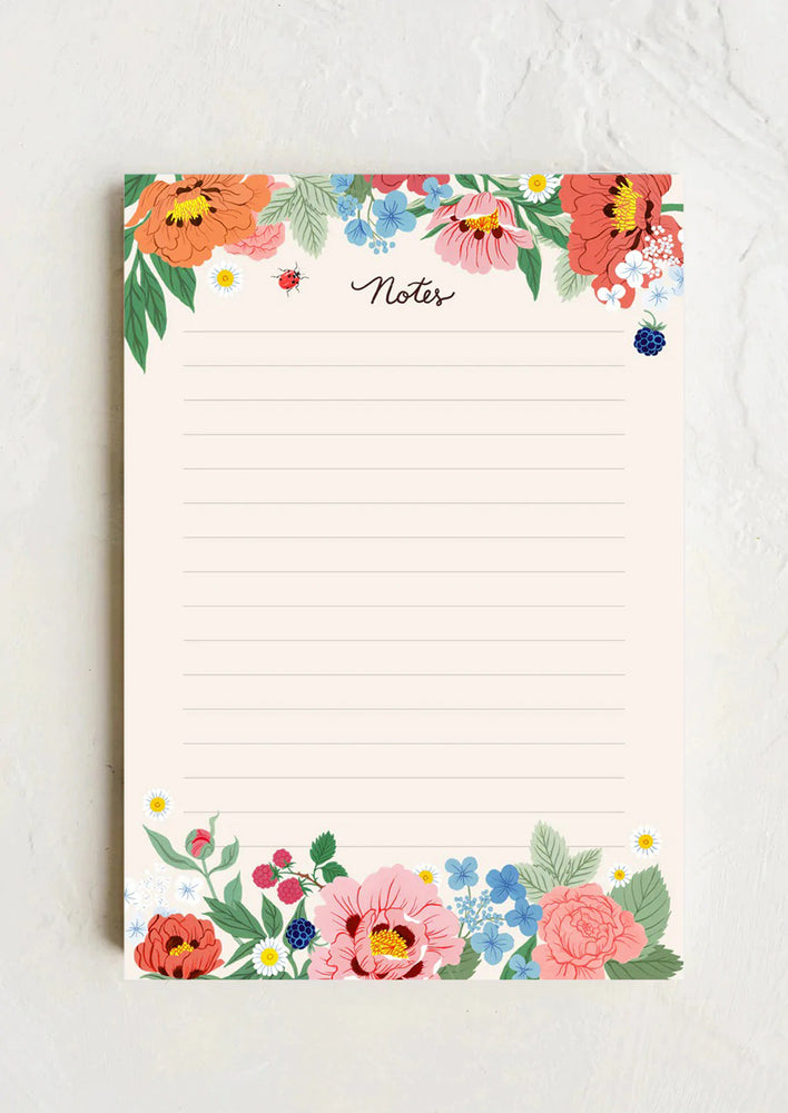 1: An off-white ruled notepad with floral garden border reading "Notes" at top.
