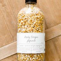 2: A glass bottle of small kernel popcorn.